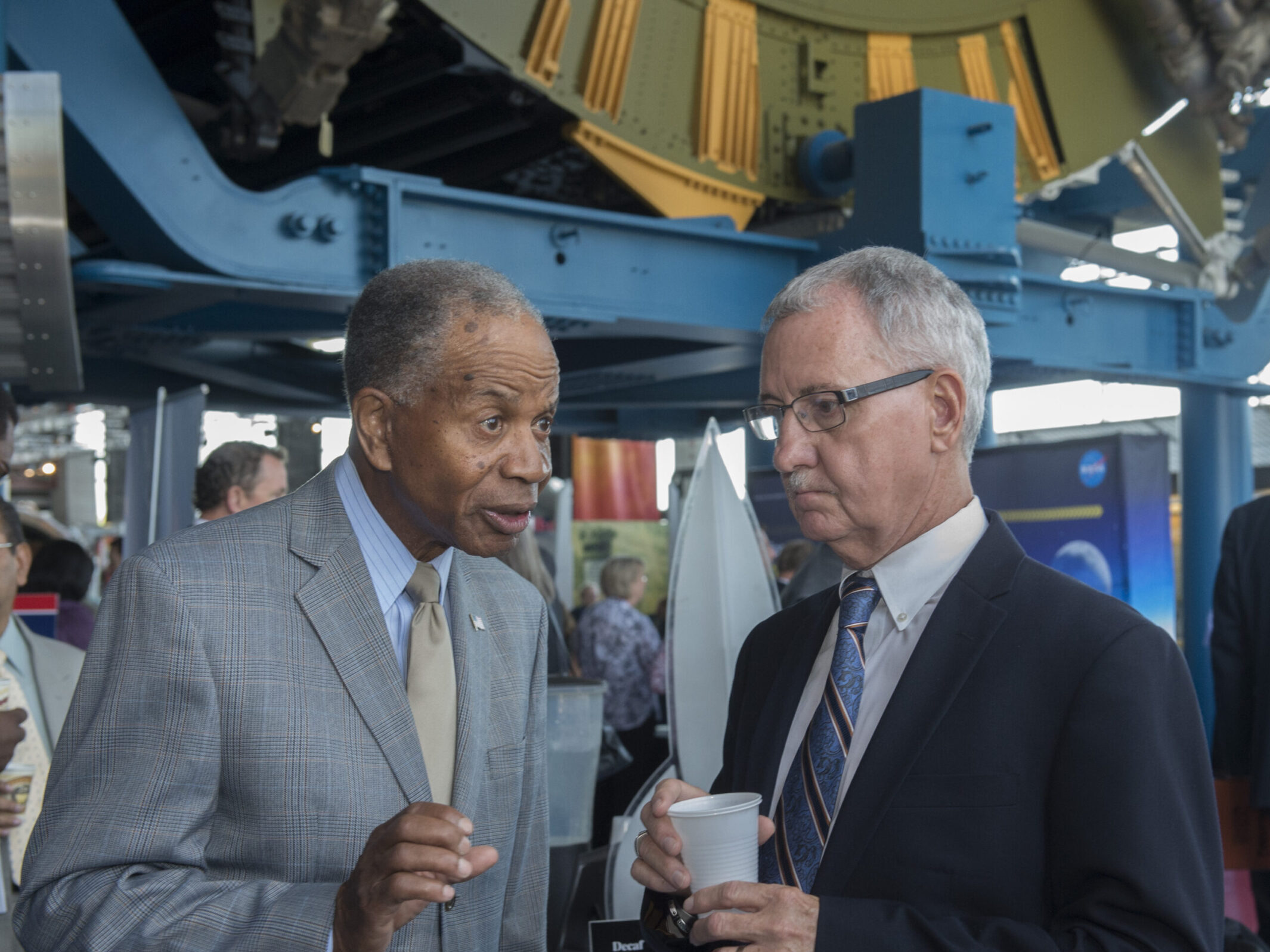 Dr. Marvin Carroll, left, president of Tec-Masters Inc. of Huntsville, speaks with David Brock, small business specialist at Marshall.